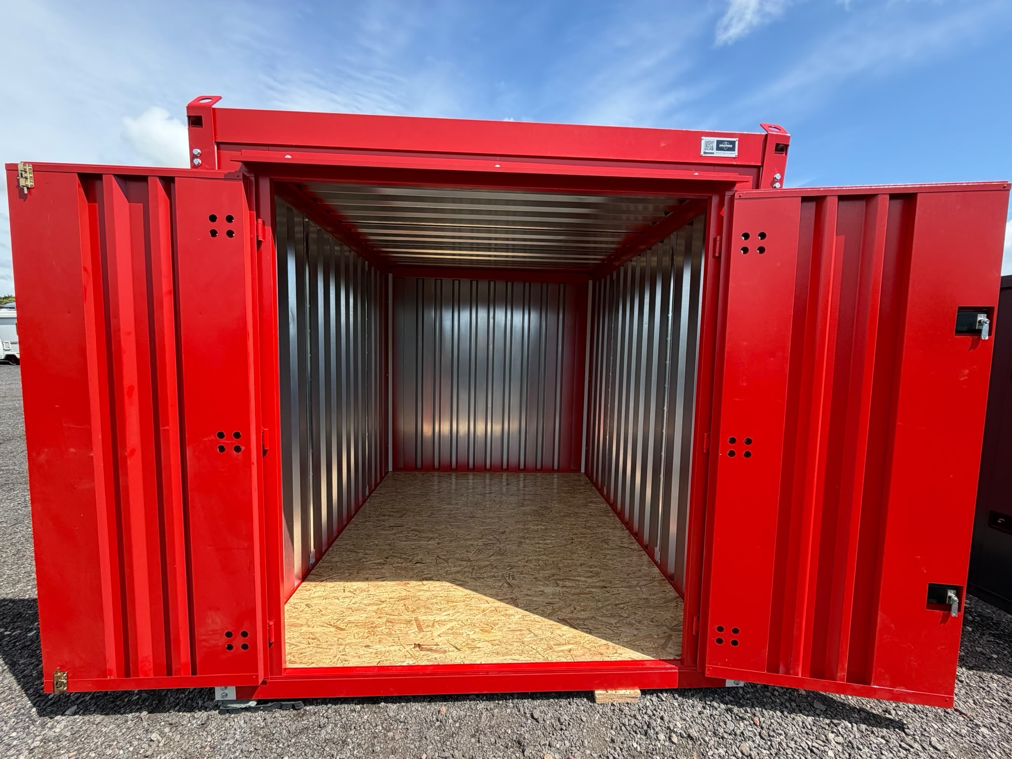 Red steel MultiStoreBox site storage container with doors open
